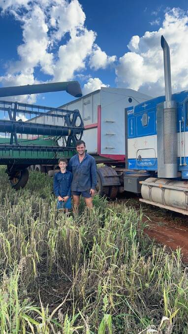 Coalstoun Lakes grain grower Cameron Rackemann with son Riley recently planted oats and said he's very concerned FAW could destroy it after the pest razed his sorghum and French millet last summer. Picture: Supplied