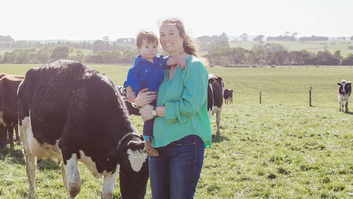 Central Queensland University associate professor Amy Cosby on her dairy farm in Gippsland, Victoria, with son Oscar. Picture supplied.