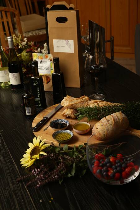 Immersed: Hunter Valley olive oil, wine, fruit and bread on the table at the Farr home.