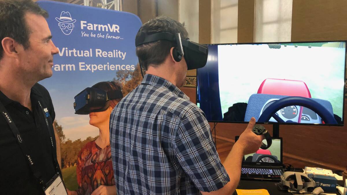 TAKING THE WHEEL: Think Digital, founder, Tim Gentle demonstrated the virtual reality farm experience to a number of willing farmers at the AgriFutures Evoke Ag conference, held in Melbourne last week.