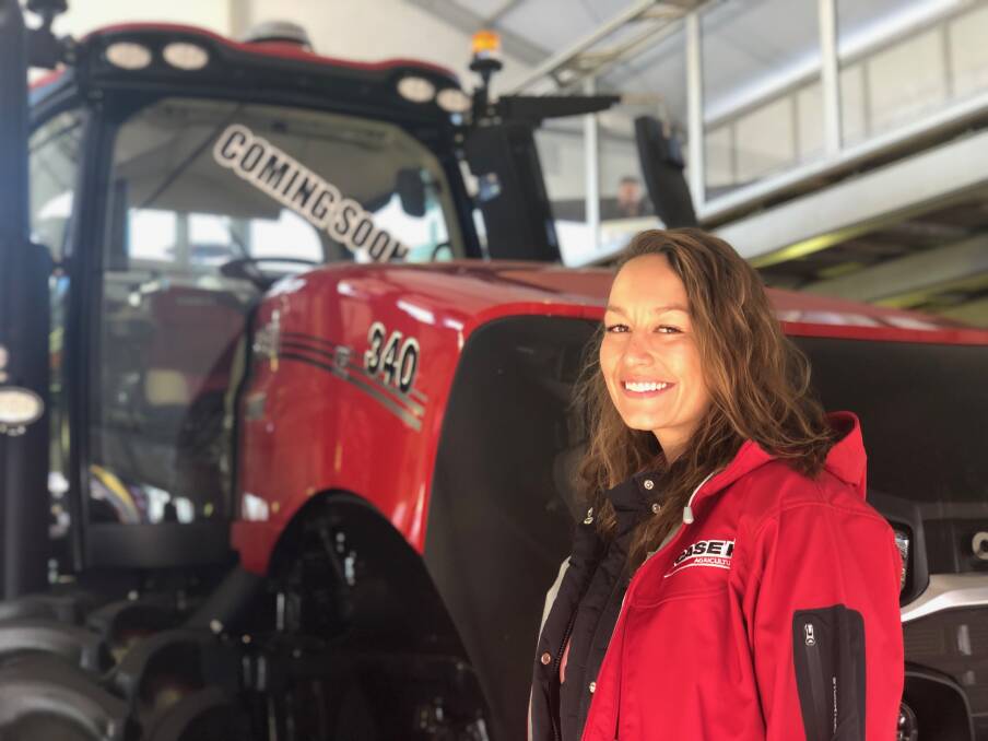 COMING SOON: Case IH high horsepower tractor manager Alyx Selsmeyer with one of the prototype AFS Connect Magnum's displayed at AgQuip. 