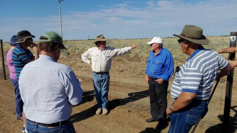 Members of the National Wild Dog Action Plan inspecting the cluster fences in Barcaldine, QLD.