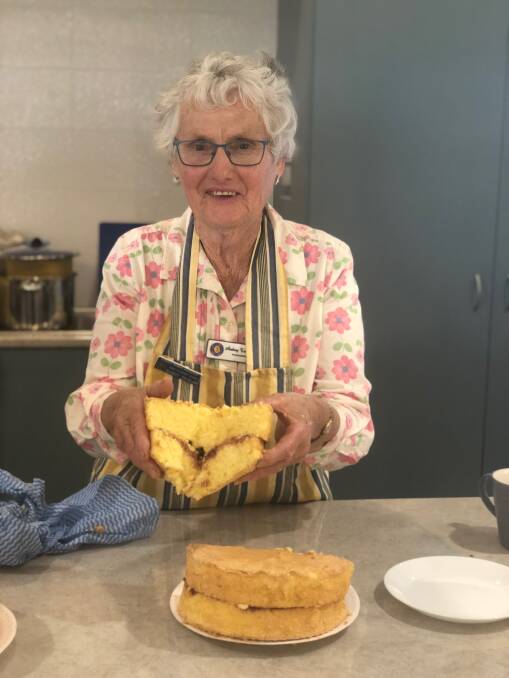 JUDGING SPONGE: Audrey Tremain from the Wongarbon Country Women's Association branch displayed how sponges were tested in competition cooking. 