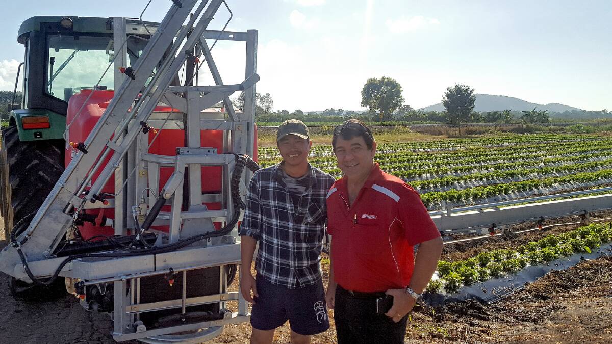 Townsville district vegetable grower Quin Nyugen takes delivery of his new Silvan Super Series linkage sprayer from Silvan area manager Frank Torrisi.