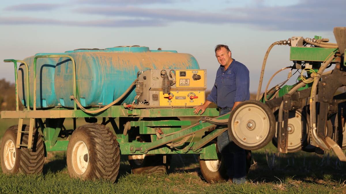 LIQUID GOLD: Yass NSW farmer Sam Kelly with his Liquid Systems SA PR-1 pump and control module which is mounted on a tow behind liquid cart. 