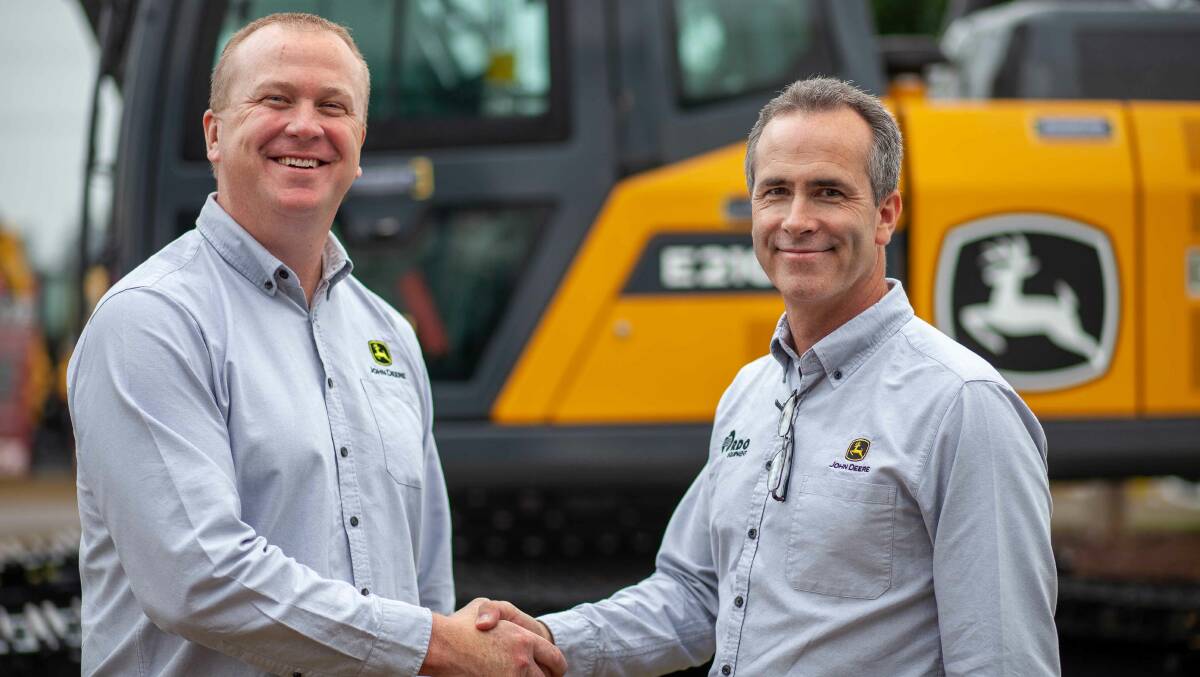 NEW PARTNERSHIP: RDO Equipment general manager of sales, John Deere Construction & Forestry Australia, Mark Kuhn (right) and Jeff Kraft, the managing director for Asia-Pacific and Africa John Deere Construction and Forestry, officially announce RDO as the companies new dealership at Diesel Dirt and Turf 2019.