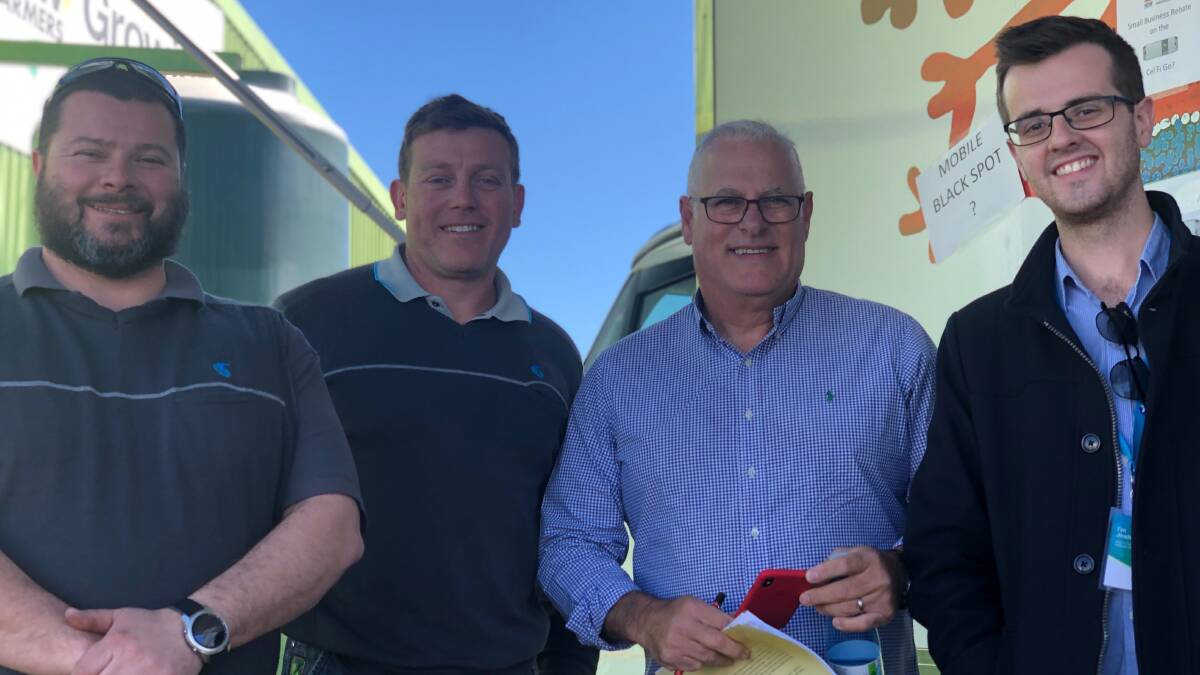 STAY CONNECTED: Telstra's Michael Cox, Brad Hopkins, Michael Marom and Joshua Fulwood at the Telstra mobile tech lab on-site at AgQuip where customers could get personalised support to improve their digital connectivity. 