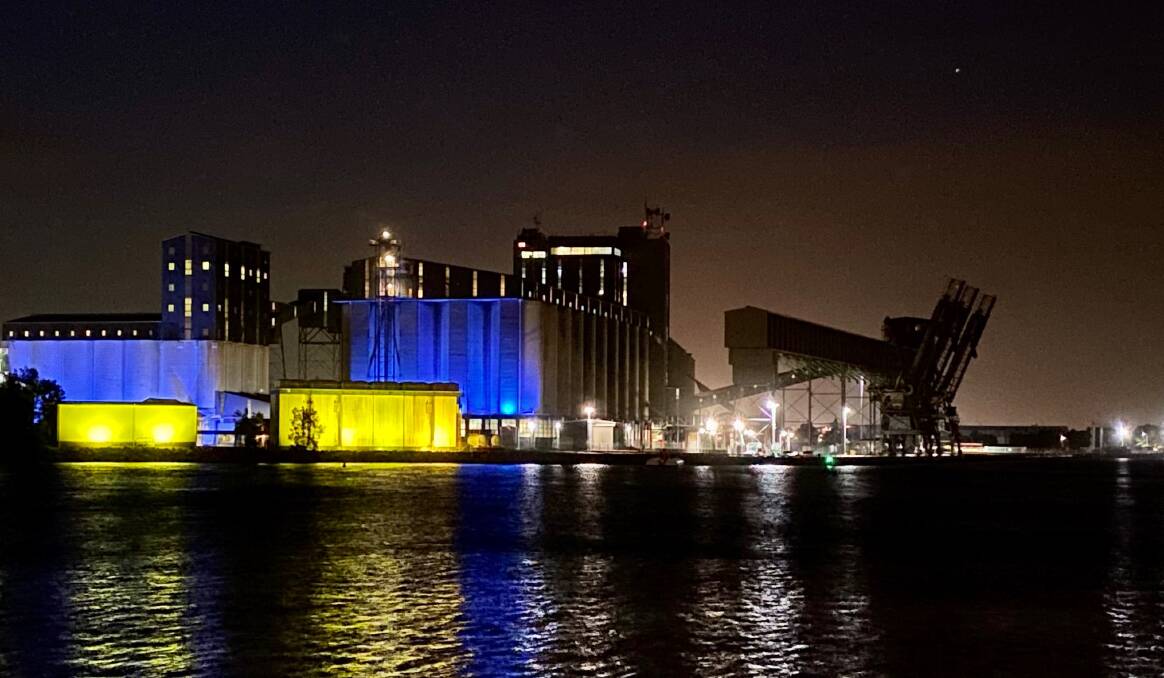 Solidarity: GrainCorp's Newcastle export terminal at Carrington lights up in Ukrainian flag colours to show support for the country's defiant battle against invading Russia, especially for the company's Ukranian-based employees and grain industry associates.