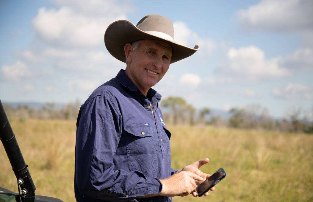 Andrew Winks at Nooroomba Feedlot, Maidenwell, Queensland using the upgraded Coles application on his smartphone.