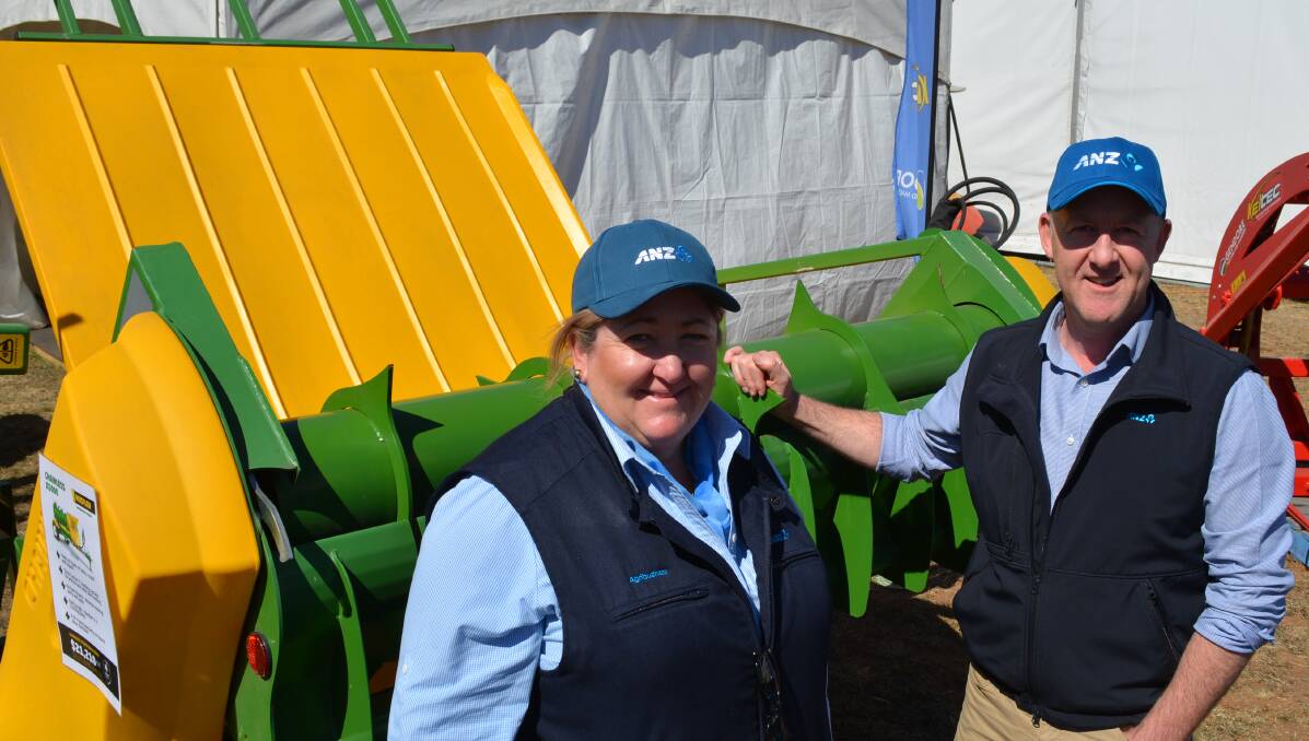 ANZ Banking Group’s Wee Waa agribusiness manager Ann-Maree Galagher discussing upbeat borrowing inquiries at last month's AgQuip field days with NSW head of regional business banking, Stuart Hancock. 