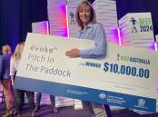 Beef in Australia's Pitch in the paddock winner, Dr Bronwyn Darlington from Agscent, with her prize money. Photo Andrew Marshall.