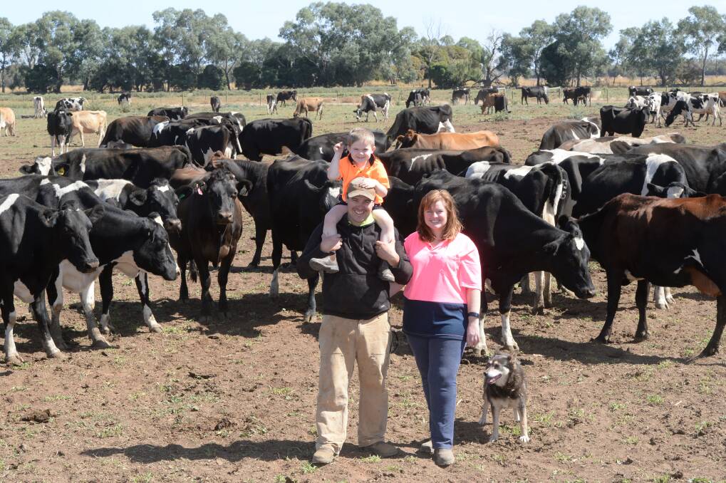 Aaron and Rikki-Lee Tyrrell with their son Emmett, 4, and their dog at Tyrrells Family Dairy, Invergordon Vic. Photo: Rachael Webb