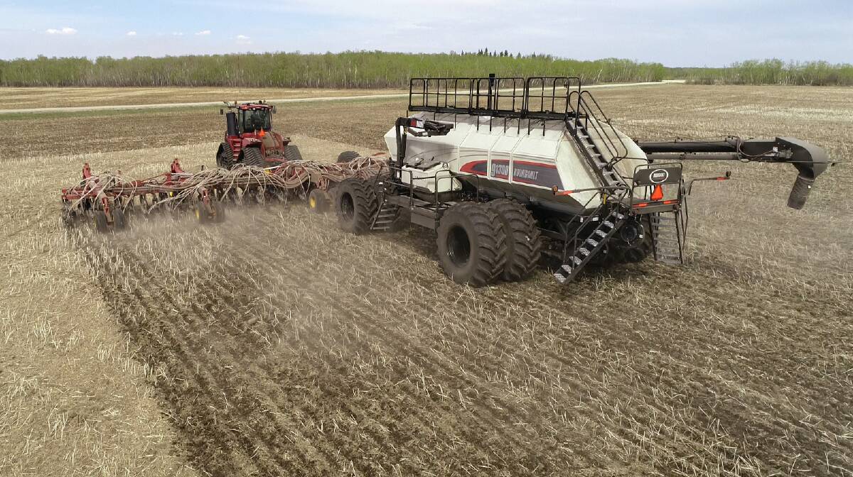 Towering above the tractor, Bourgault's "top of the line" 91300 Airseeder seen working in Saskatchewan, Canada. Lake Grace farmers Leon Clarke and family have become the first in Australia to purchase the largest airseeder in the world and look forward to it arriving later in the year in time for the 2022 season.
