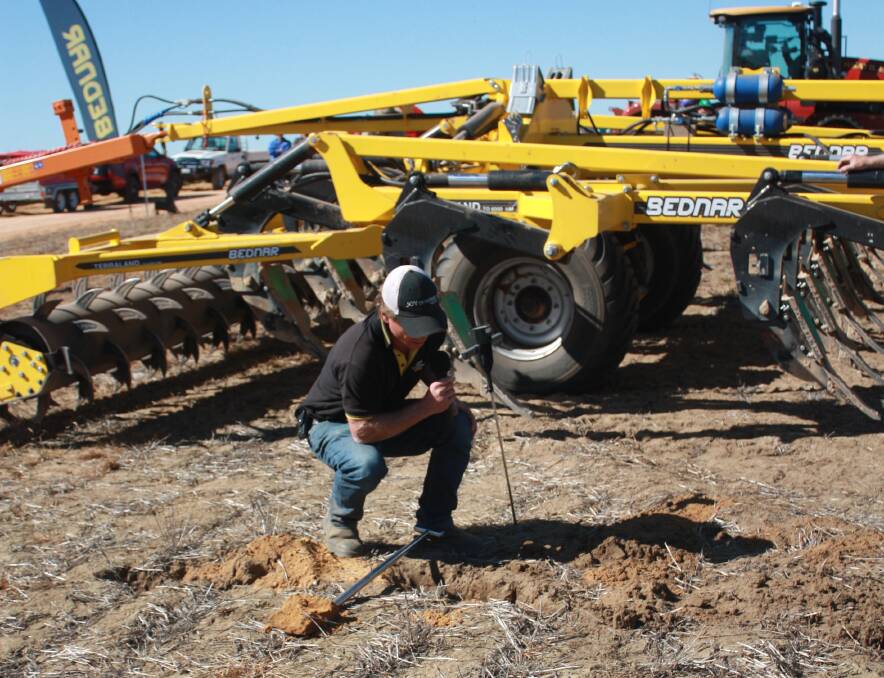 Bednar Australia representative Grant Borward uses a penetrometer to illustrate soil resistance. "You can quickly gauge if you've hit a hard pan," he said. A penetrometer was a useful tool because hard pans can occur at varying depths depending on soil types.