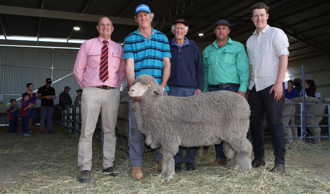 Andrew Peters (left), Elders Merredin, buyers John and Bob Goodier, Tyndale stud, Merredin, Aaron Caldwell, Livestock and Land, Nutrien Livestock Central Wheatbelt and Curtis Mackin, Kamballie stud, Tammin, with the $6500 second top-priced ram at the Kamballie sale.