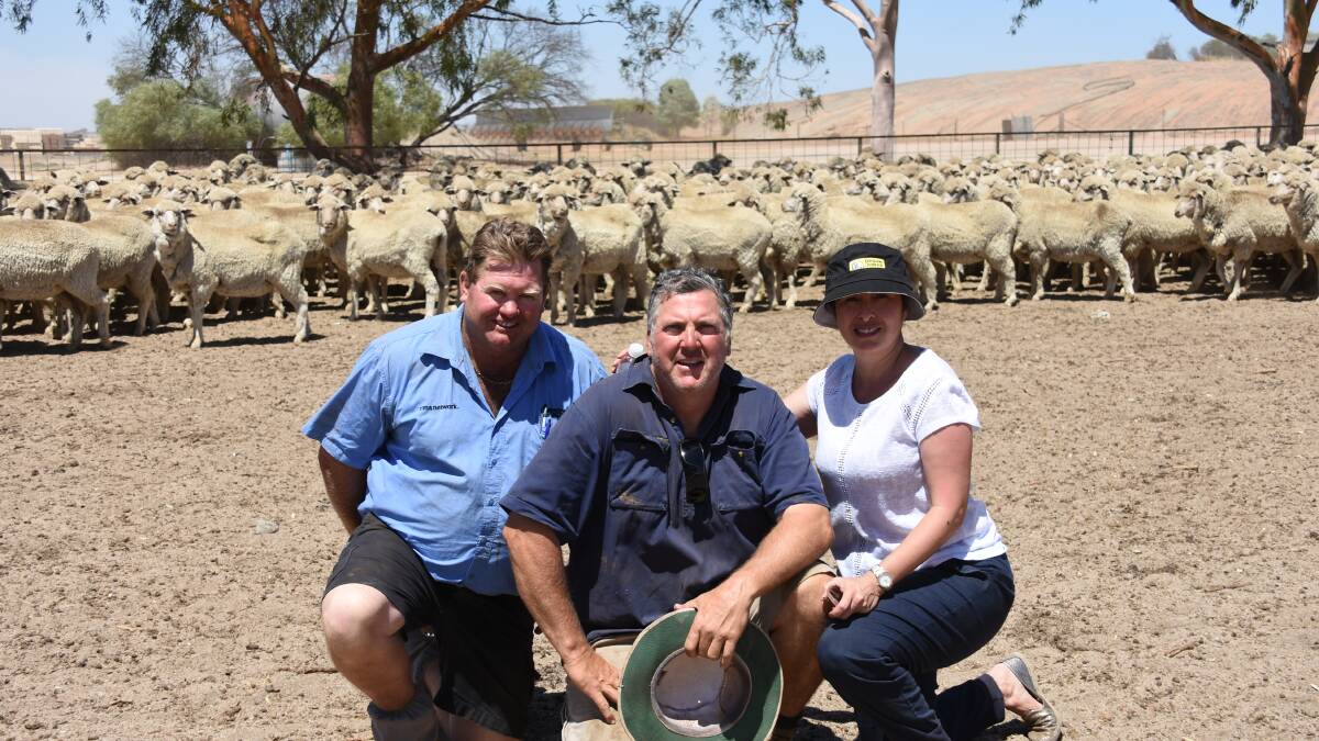 With the $310 record breaking line of rising two-year-old ewes that set a new State record price for commercial ewes last week at the Varone family's flock dispersal at Little Italy, via Hyden are Westcoast Wool & Livestock manager Lincon Gangell and vendors Carlo and Jenny Varone.