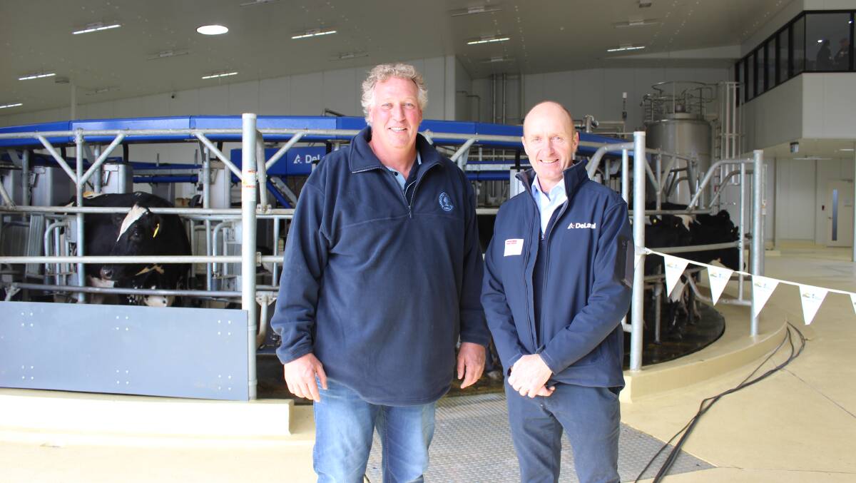 Bannister Downs Dairy general manager Mat Daubney (left) and DeLaval robotics sales manager David Widdicombe in front of the 24-stand robotic rotary dairy platform installed in The Creamery.