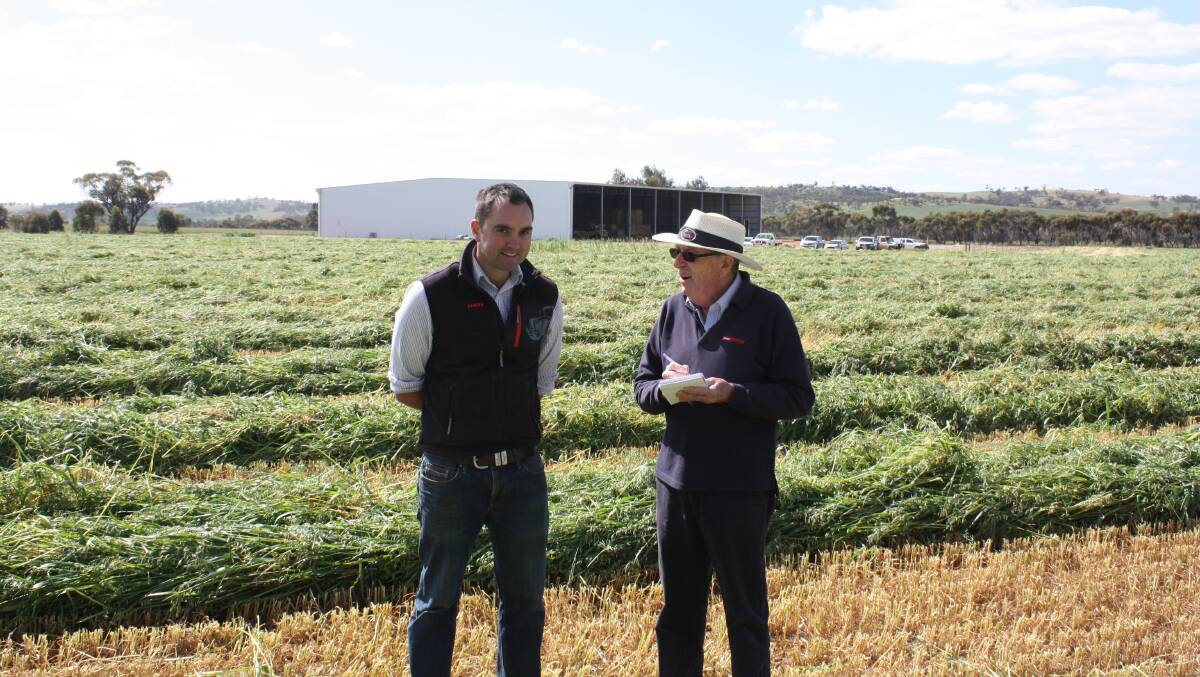 Ken (right) on the job interviewing a CLAAS Harvest Centre representative during a hay-making demonstration in 2016.