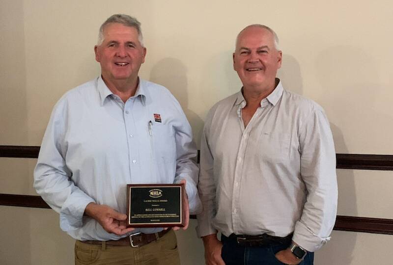 Bill Cornell was presented with his NHIA Laurie Wells Meritorious Service Award by Paul Quinlan.