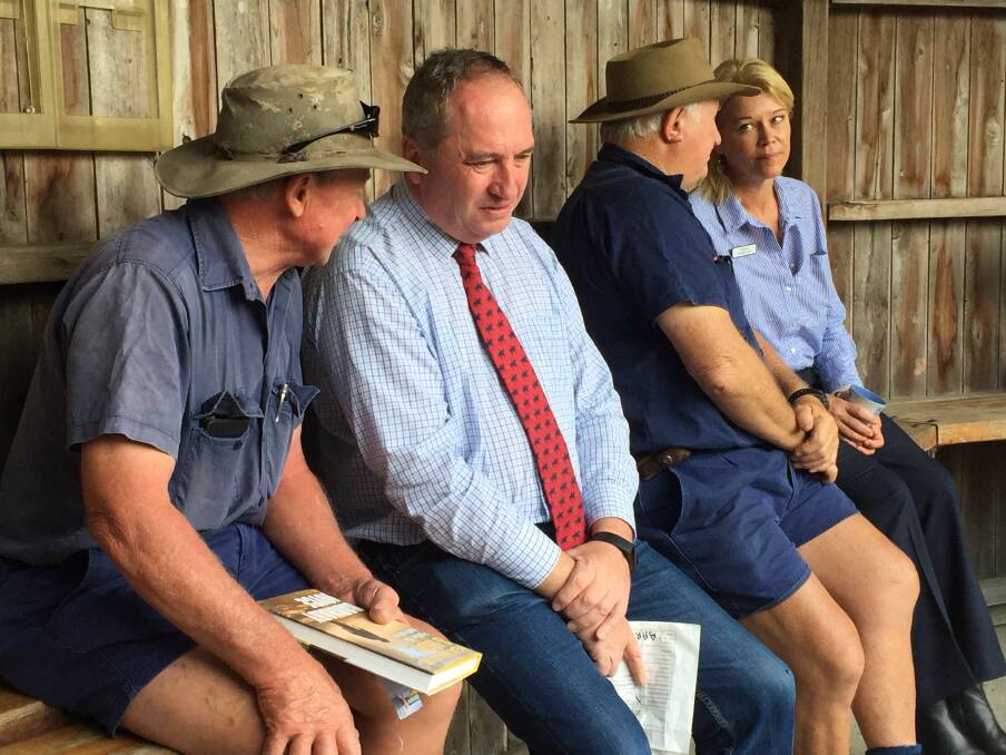 Bomaderry farmer John Bryce and MP Barnaby Joyce talk during the weekly cattle sale at Nowra on Thursday. Photo: Hayley Warden.