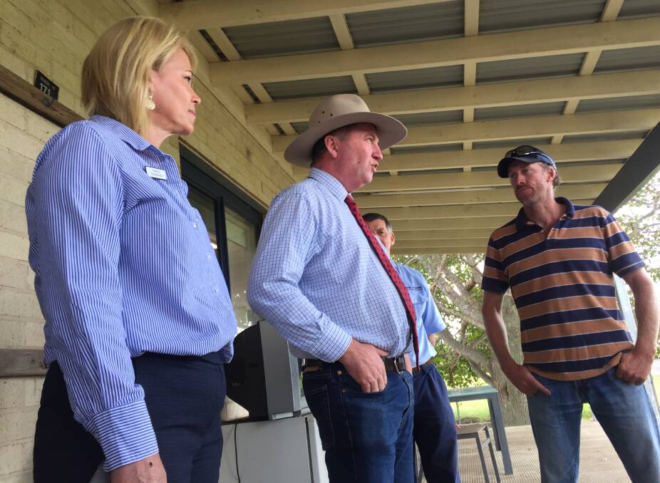 Gilmore's National Party candidate Katrina Hodgkinson and MP Barnaby Joyce talk to Terara dairy farmer Tim Cochrane. Photo: Hayley Warden.