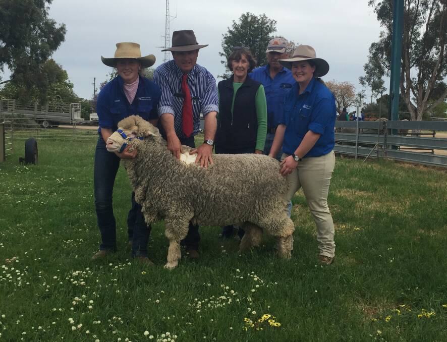 Attributes: Debbie and Graham Mott, Yerong Creek (centre) bought Avenel Poll Merino's top-priced ram for $6500 at the 2020 sale.
