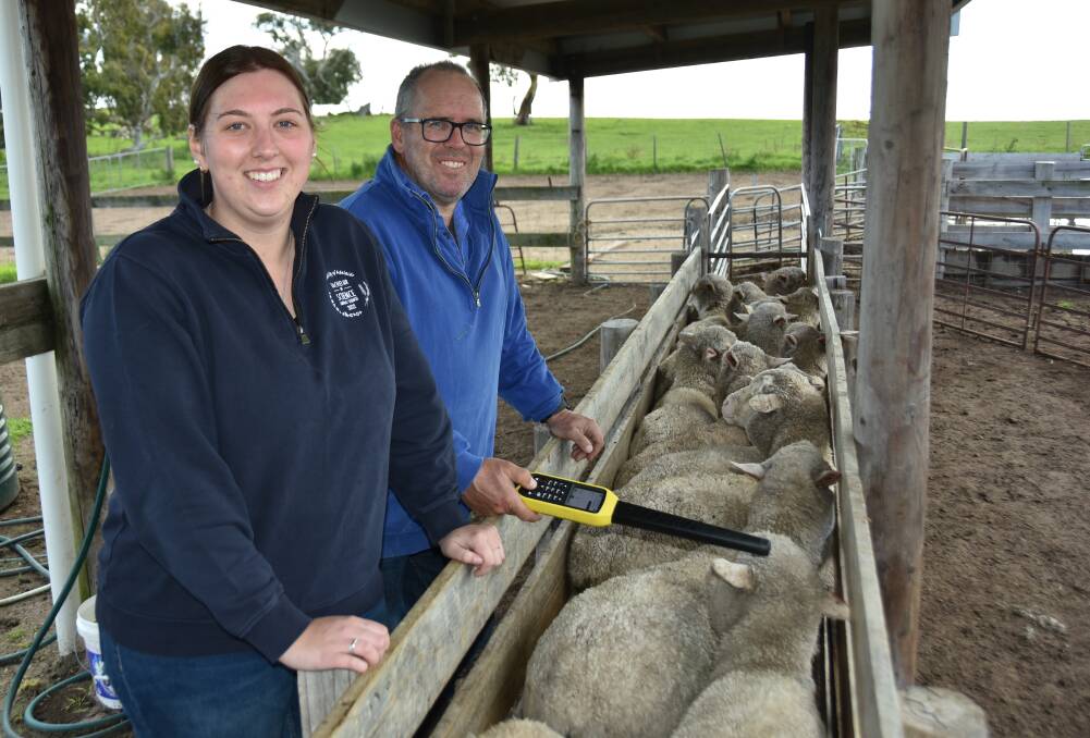 AgInnovate graduate consultant Jessie Daniel and business owner Jonathan England are working with sheep producers to help them get the most out of eID. Picture by Catherine Miller