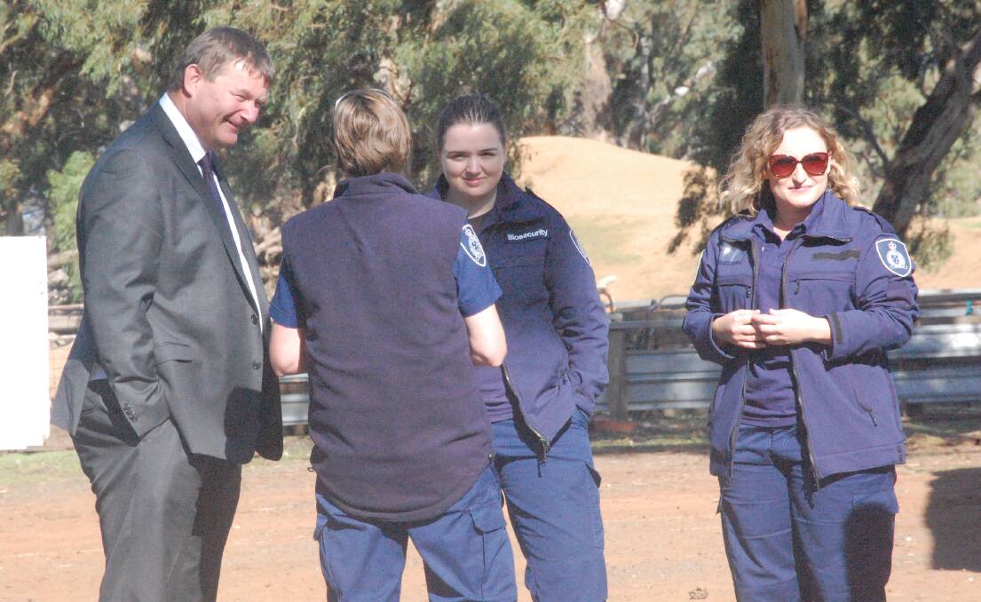 Chief veterinary officer Dr Charles Milne speaks with Agriculture Victoria officers.