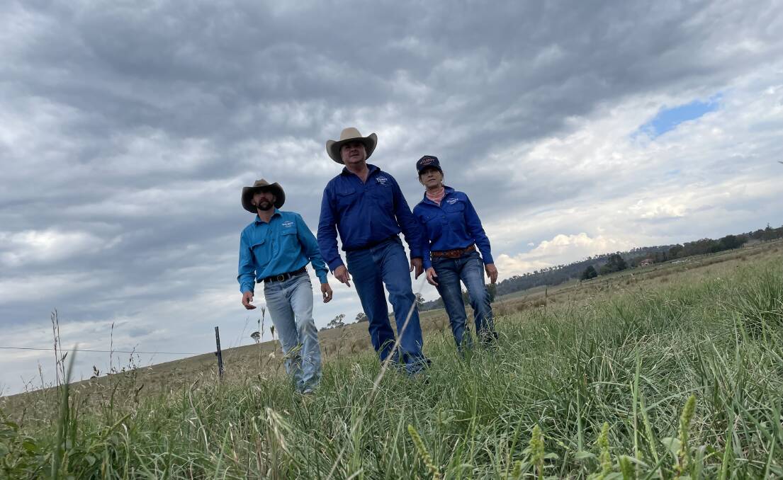 Woodburn's overseer Luke Goodridge and managers Grant and Tanya Wickham in one of the New England beef property's breeder paddocks. Picture Shan Goodwin.