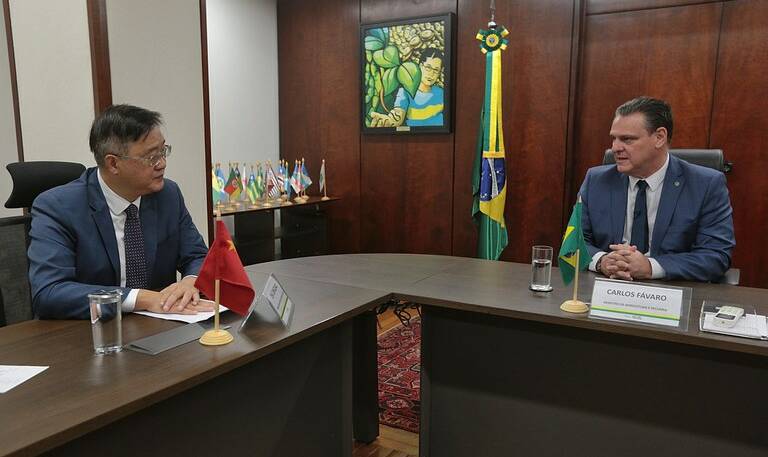 Brazil's Minister of Agriculture and Livestock, Carlos Favaro and the Chinese ambassador to Brazil, Zhu Qingqiao, meet to discuss the confirmed case of mad cow disease this week. 