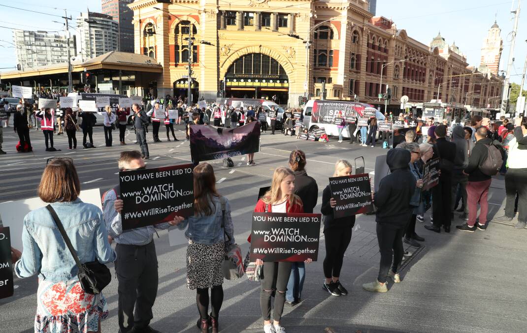 ACTIVE AND ANTI-MEAT: Animal rights protesters block key streets in Melbourne during early morning traffic. Photo David Crosling. 
