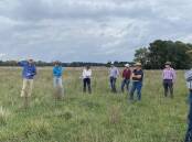 Agriculture scientist Bart Davidson, chief grazing officer with Atlas Carbon, discusses the benefits of rotational grazing with producers at Wilmot Cattle Company's Woodburn property, near Walcha in NSW. Picture Shan Goodwin.