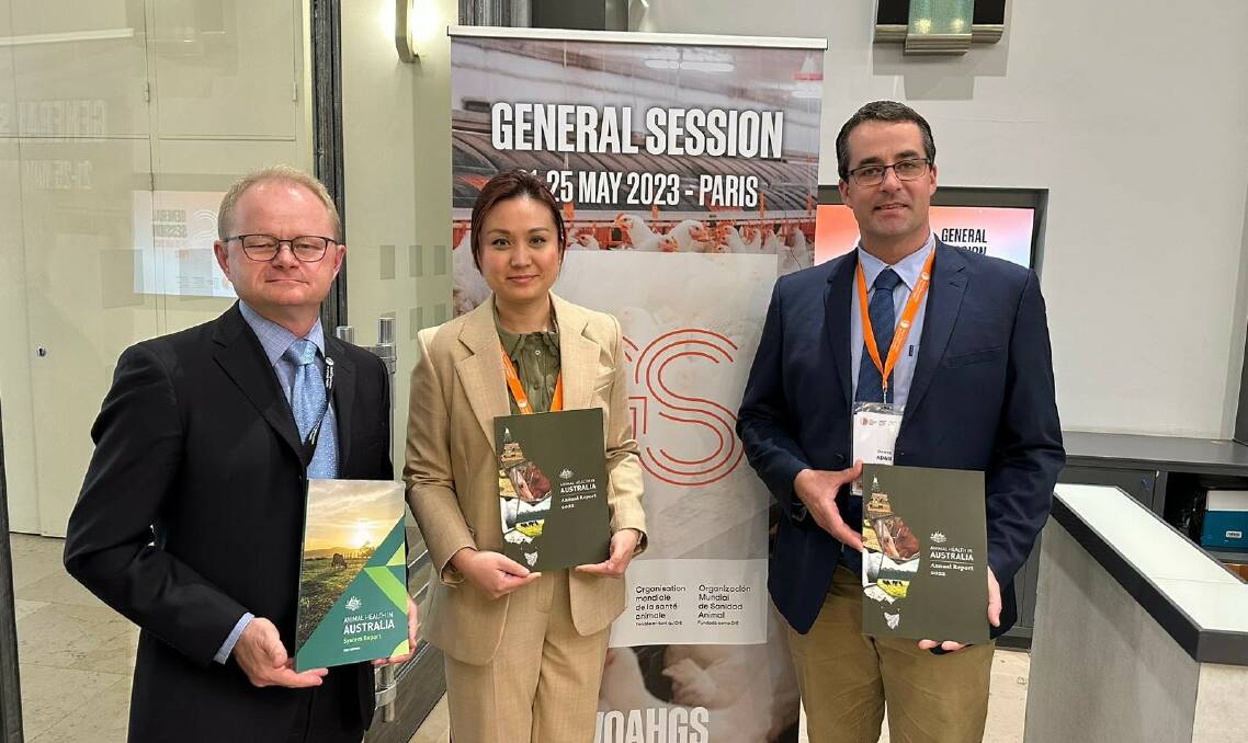 Dr Mark Schipp, Australian chief veterinarian, Dr Mary Wu and Adam Dawes showcasing the Animal Health in Australia 2022 Annual Report in Paris at the World Organisation for Animal Health General Summit. Picture DAFF.