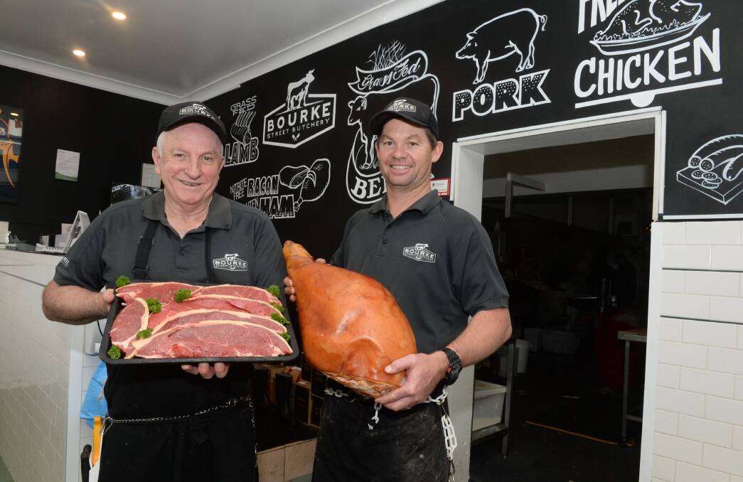 BUSY TIMES: David Sharkey and Ray Pearson show samples of the quality beef and pork they sell at the Bourke Street Butchery in North Dubbo. PHOTO: Mark Griggs