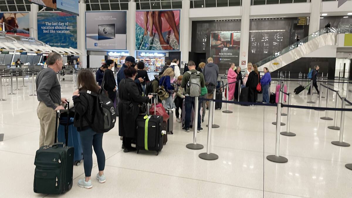 The wait continues at JFK Airport for the exhausted passengers.