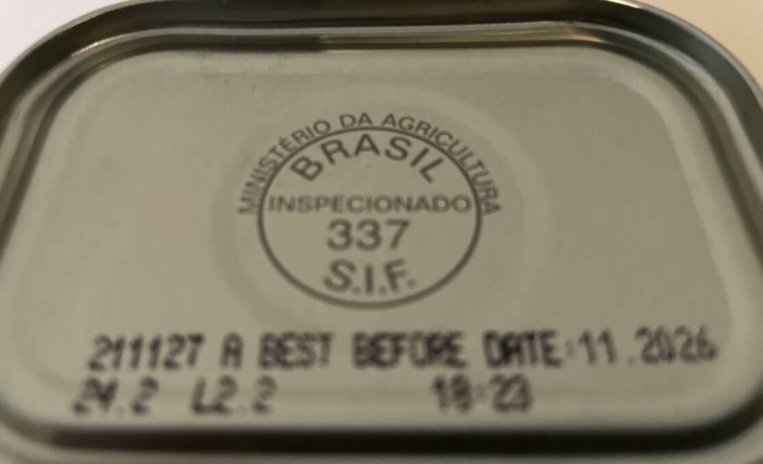 The top of a can of meat shows it was inspected in the country of origin, not in Australia. 