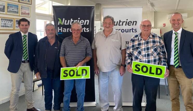 Nutrien Harcourt's Troy Goldsworthy, from left, with happy vendors Joe, Colin, Graham and Les Butler and SA/NT Nutrien Harcourts manager/auctioneer Andy Edwards. Picture from Nutrien Harcourts