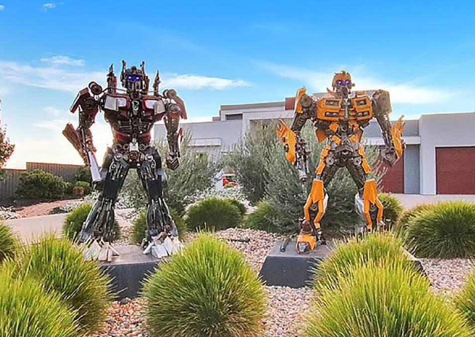 ROBOT GUARDS: Don't adjust your set, yes they are Transformers guarding this luxury home in a small country town on the River Murray. Pictures: Ray White Real Estate.
