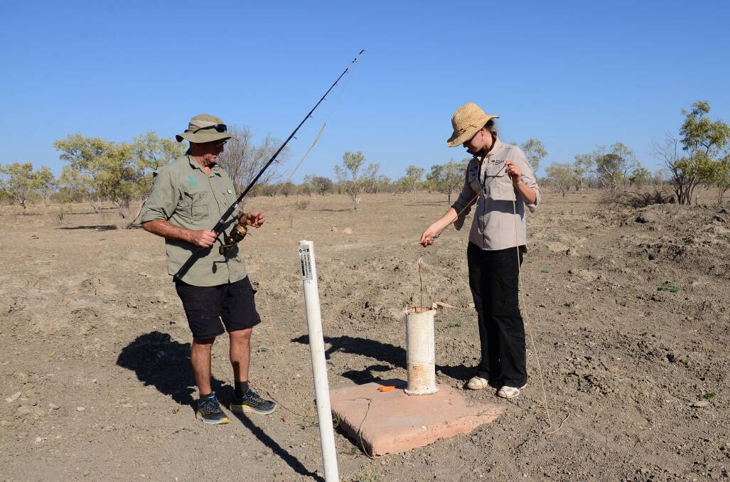 SURPRISE FIND: CSIRO's Dr Daryl Nielsen and Charles Darwin University's Dr Stefanie Oberprieler fishing for stygofauna in central Northern Territory. Pictures: CSIRO.