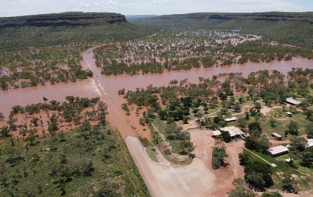 Amazing vision of key outback bridge buried by flood water