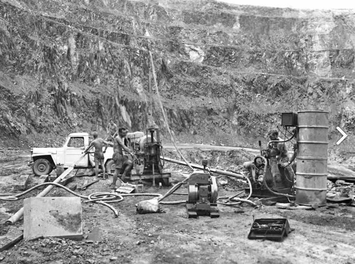 HEALTH AND SAFETY: Drilling on the floor of the uranium pit in the '50's, with the mine workers not wearing any shoes, or protection at all.