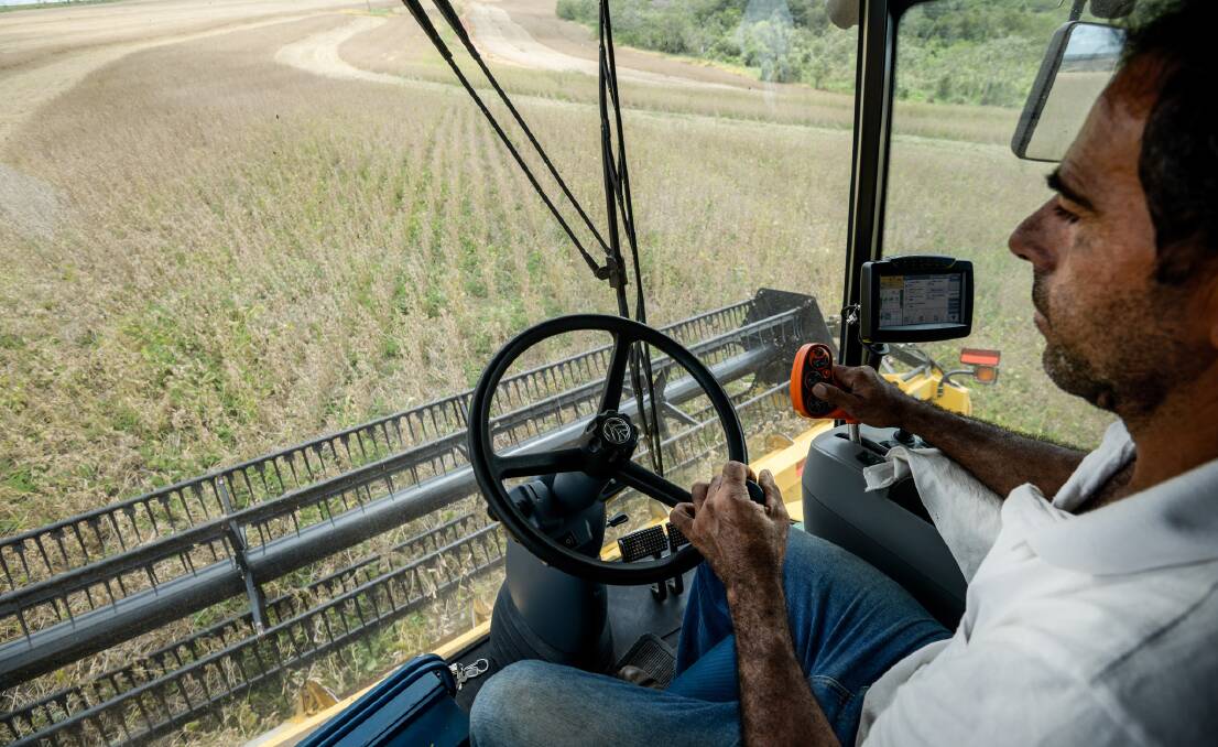 POTENTIAL: A Brazilian farmer harvests soybeans.