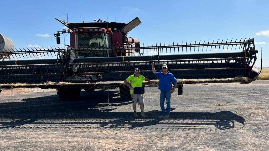Sean Murphy and Phill Eulenstein at work at the Eulenstein family's property at Moree. Mr Murphy is helping get the crop off as part of GPA's Operation: Grain Assist.