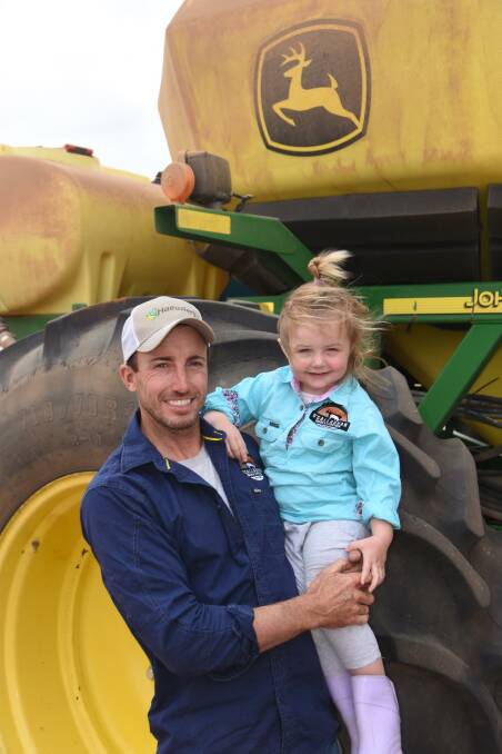 Daisy O'Callaghan accompanies dad Adam out to the paddock where he was sowing Yallara oats. 
