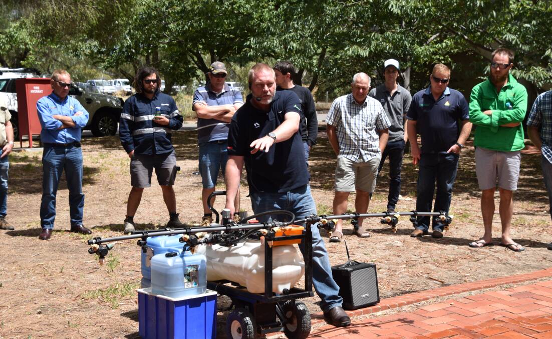 Bill Gordon demonstrates spray techniques to a group at Longerenong College, near Horsham in Victoria.