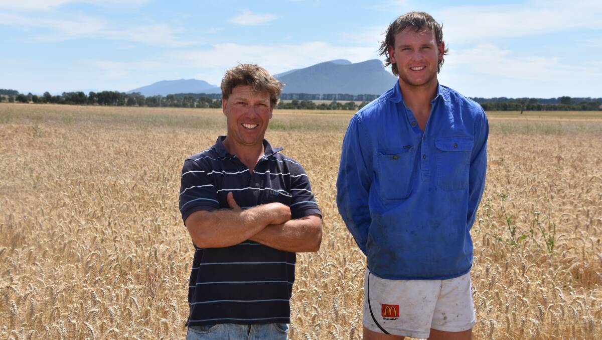 Western District farmer Paul Mibus, left with farmhand Vincent Huf at Moutajup last week. Photo: Gregor Heard.