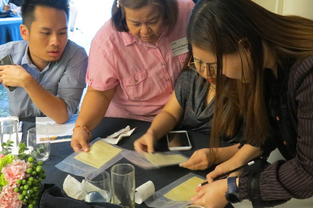 Participants in an Australian wheat seminar in Manilla in the Philippines assess how our wheat performs.