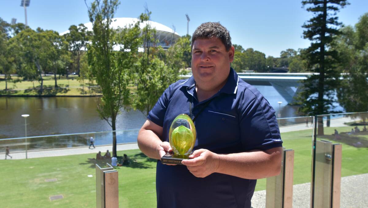Michael Moodie with his Seed of Light award this week in Adelaide. Photo by Gregor Heard.