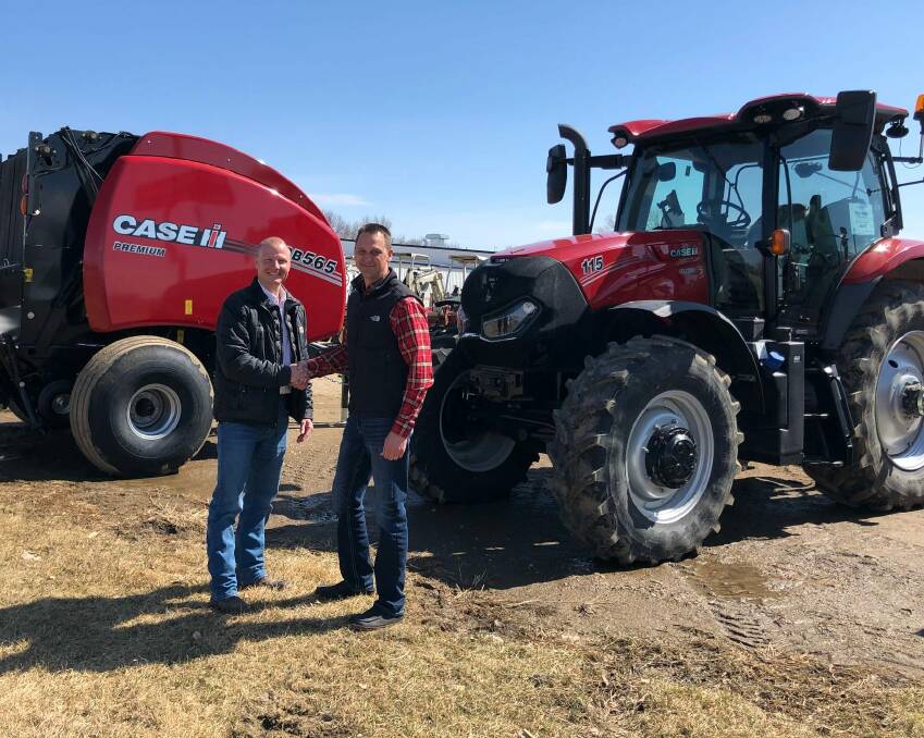Titan Machinery's BJ Knutson (left) with a customer at Yankton, South Dakota in the US. Photo supplied.