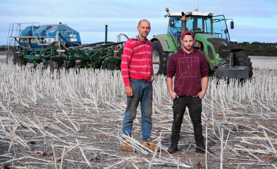 Mark Modra and farm worker Seb Eylward at planting time earlier in the year at Mr Modra's property near Cummins, SA. Photo by Katie Jackson.